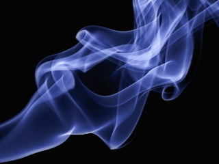 Smoke billowing from an unseen cigarette